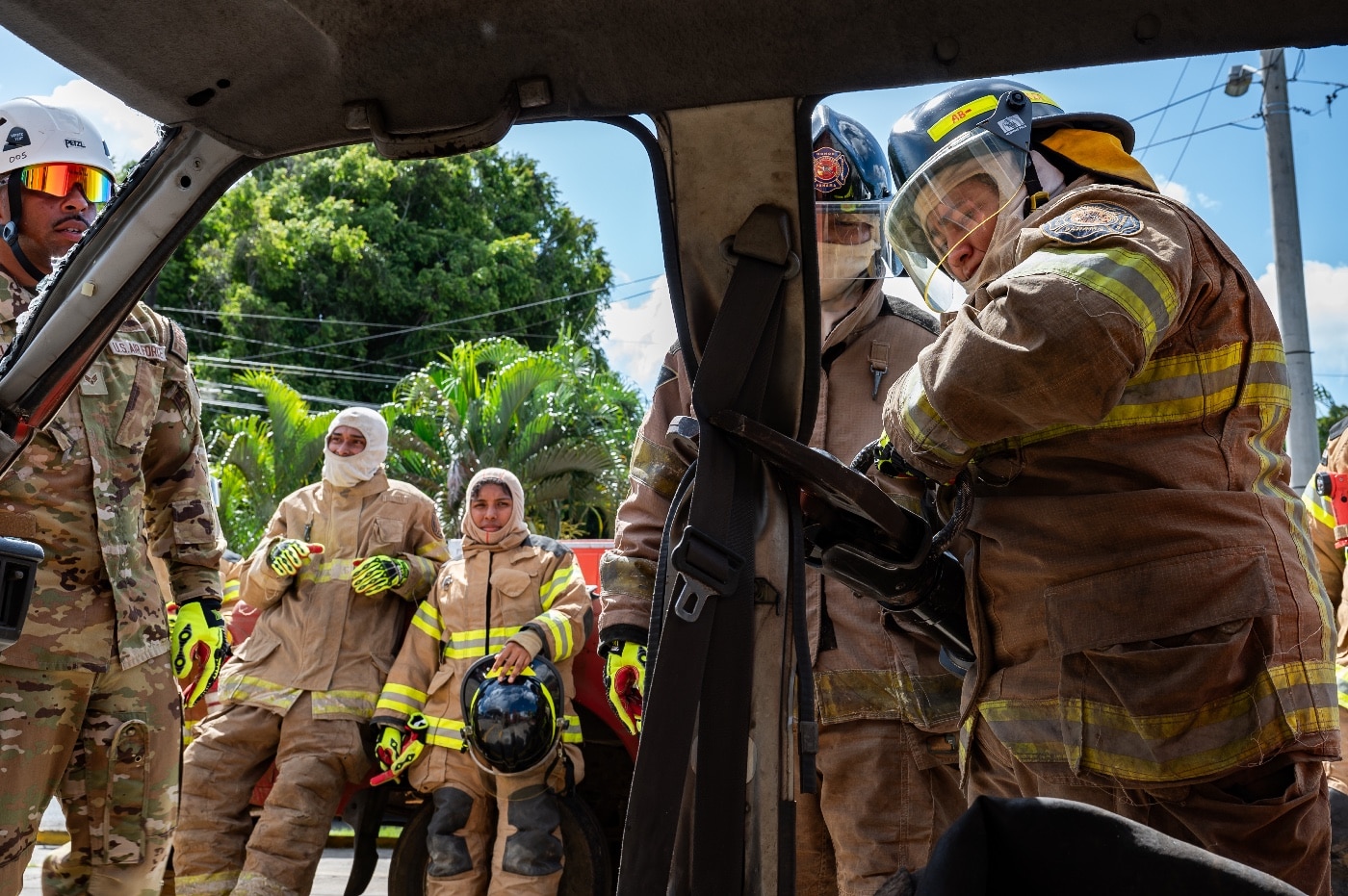 firefighters train to extricate trapped driver from car accident