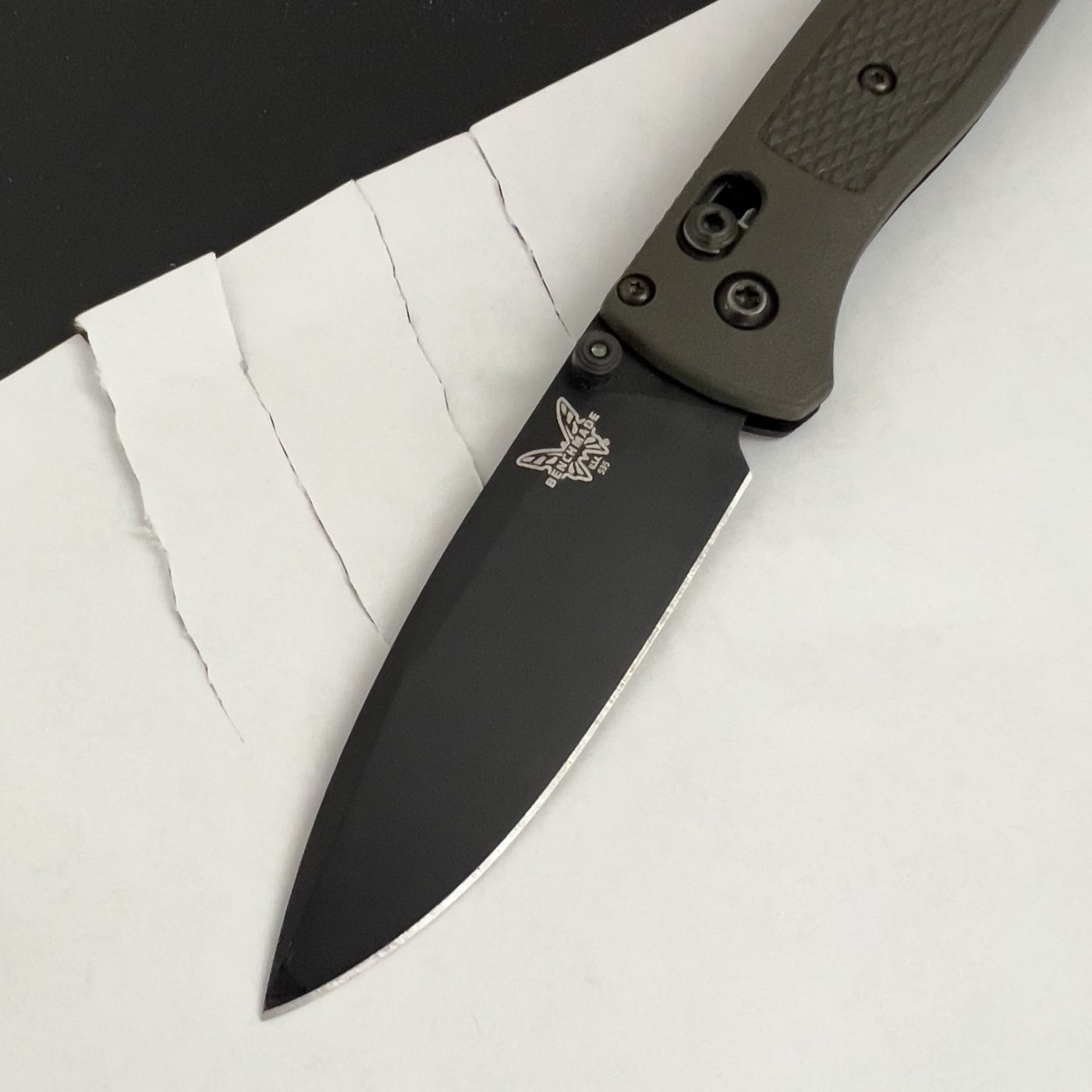 cutting paper with benchmade bugout edc folding knife