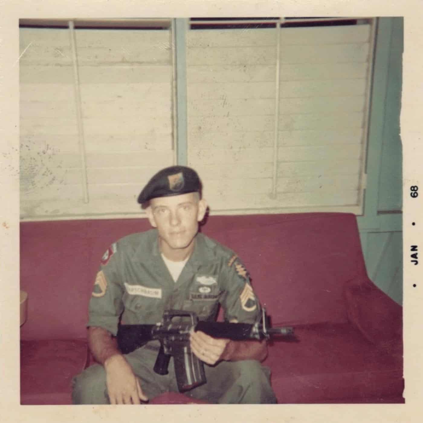 A U.S. Army Staff Sergeant of the 8th Special Forces Group poses for a photograph in the day room of his barracks at Fort Gulick in the Panama Canal Zone while holding a Mattel Marauder in January 1968.