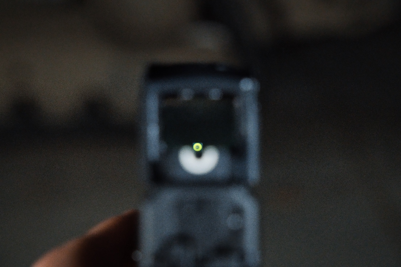 As seen in this photo, the author demonstrates how you can co-witness the factory u-dot sights with the MPS sight. The u-dot sights use a tritium vial in the front sight that allows you to index it in low to no light conditions such as at night or in a dark room.