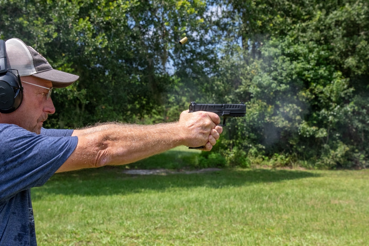 State and regional shooting champion John Strayer tests the author's Echelon. The muzzle is already back on target with a spent casing in air. He left the test planning to buy an Echelon. The frame texture helps provide a good grip. It is the same texture as the company uses on the Hellcat.
