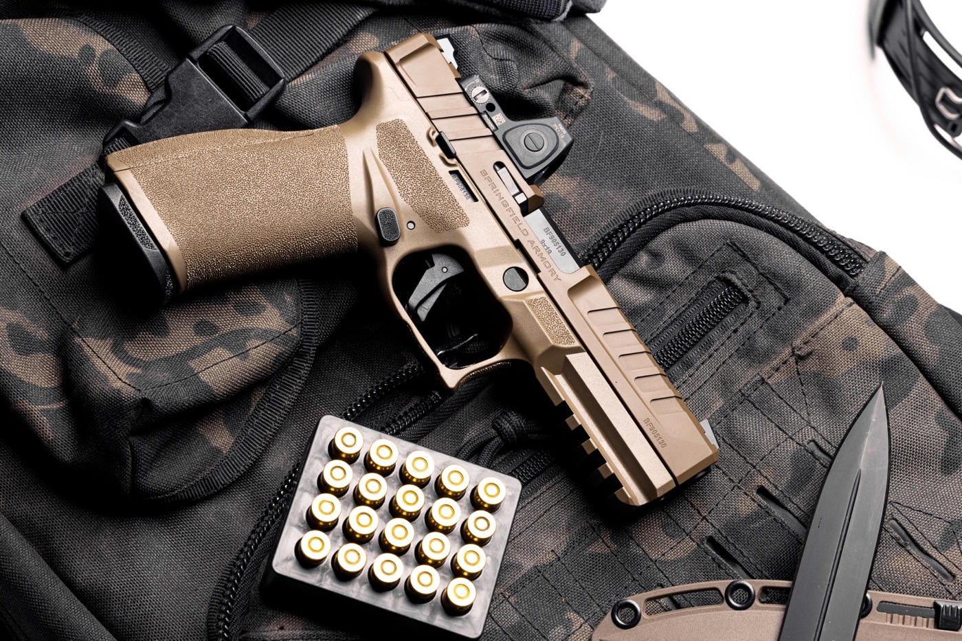 In this photograph, we see the right side of the Springfield Armory Echelon Desert FDE. We can see the deep slide serrations and aggressive grip texture on the polymer grip module.