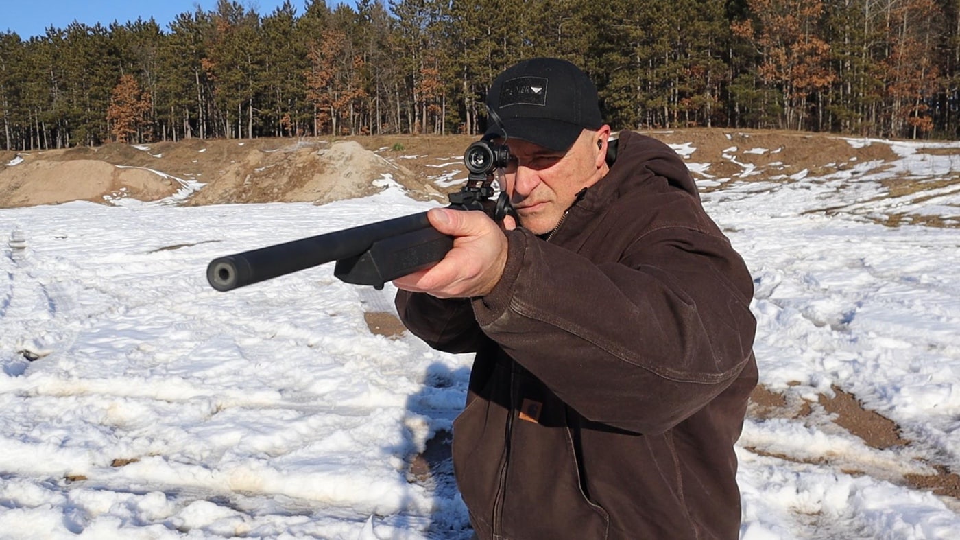 Here we see the author shooting a bolt action rifle chambered for the .22 Long Rifle rimfire cartridge. It offers excellent eye relief and versatility leading to faster target acquisition than with 3x 4x or 5x magnified scopes. This Swampfox offers a wide field of view making it good for all kinds of guns including a shotgun.