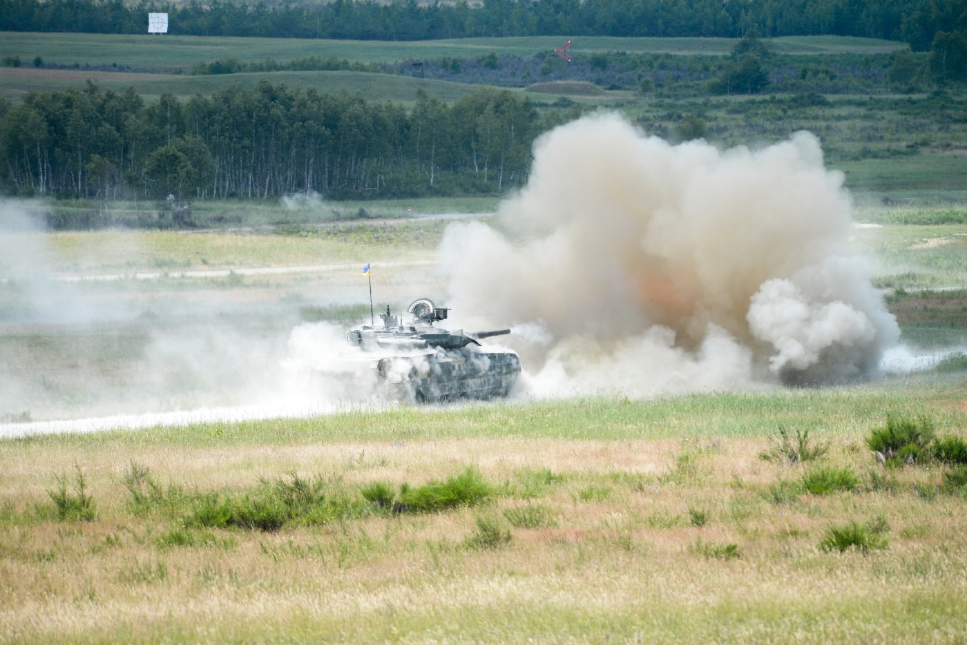 T-84 tank shoots while on the move during a training exercise. The T-84 offers many advantages over the T-80 series of tanks used by the Russian Federation and Soviet Union.