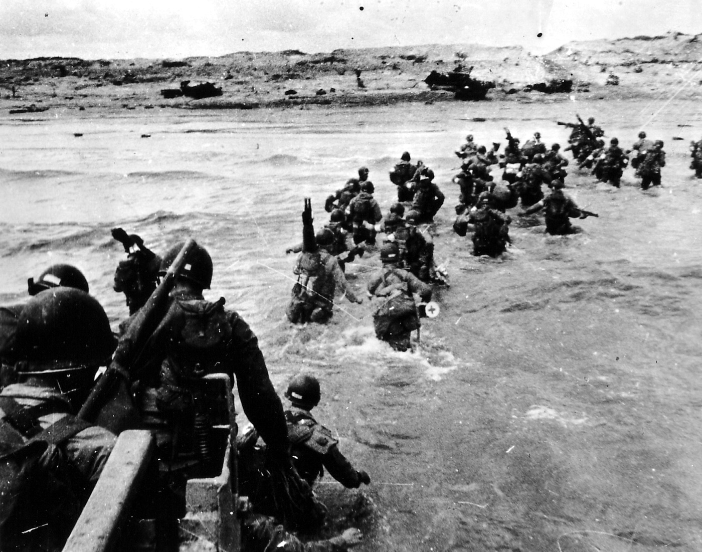 Here we see American troops wade onto the beaches during D-Day. During the morning of the attack, the troops were under constant fire from machine guns, mortars and artillery.