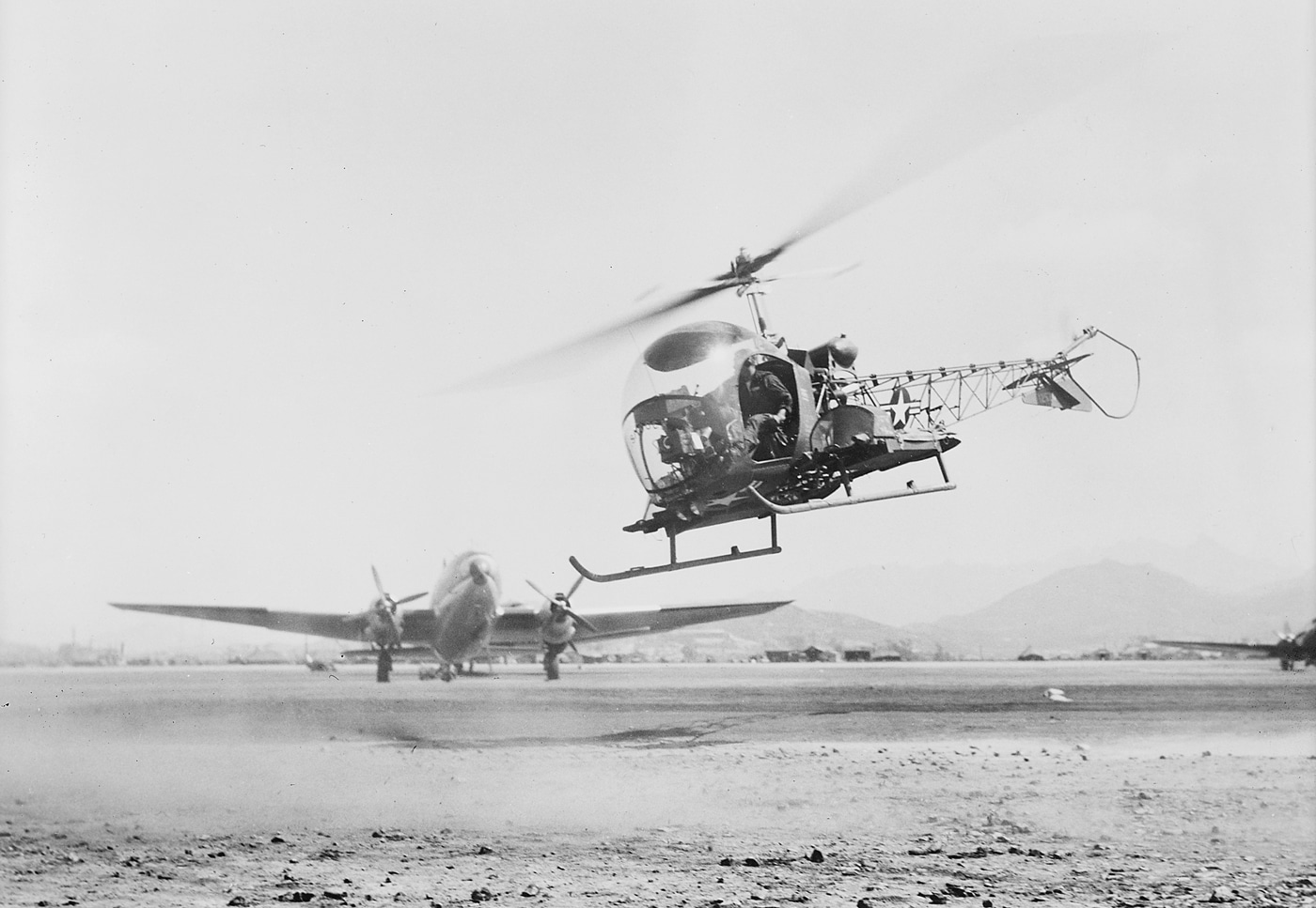Bell H-13 medevac lands at MASH unit in Korean War 1952