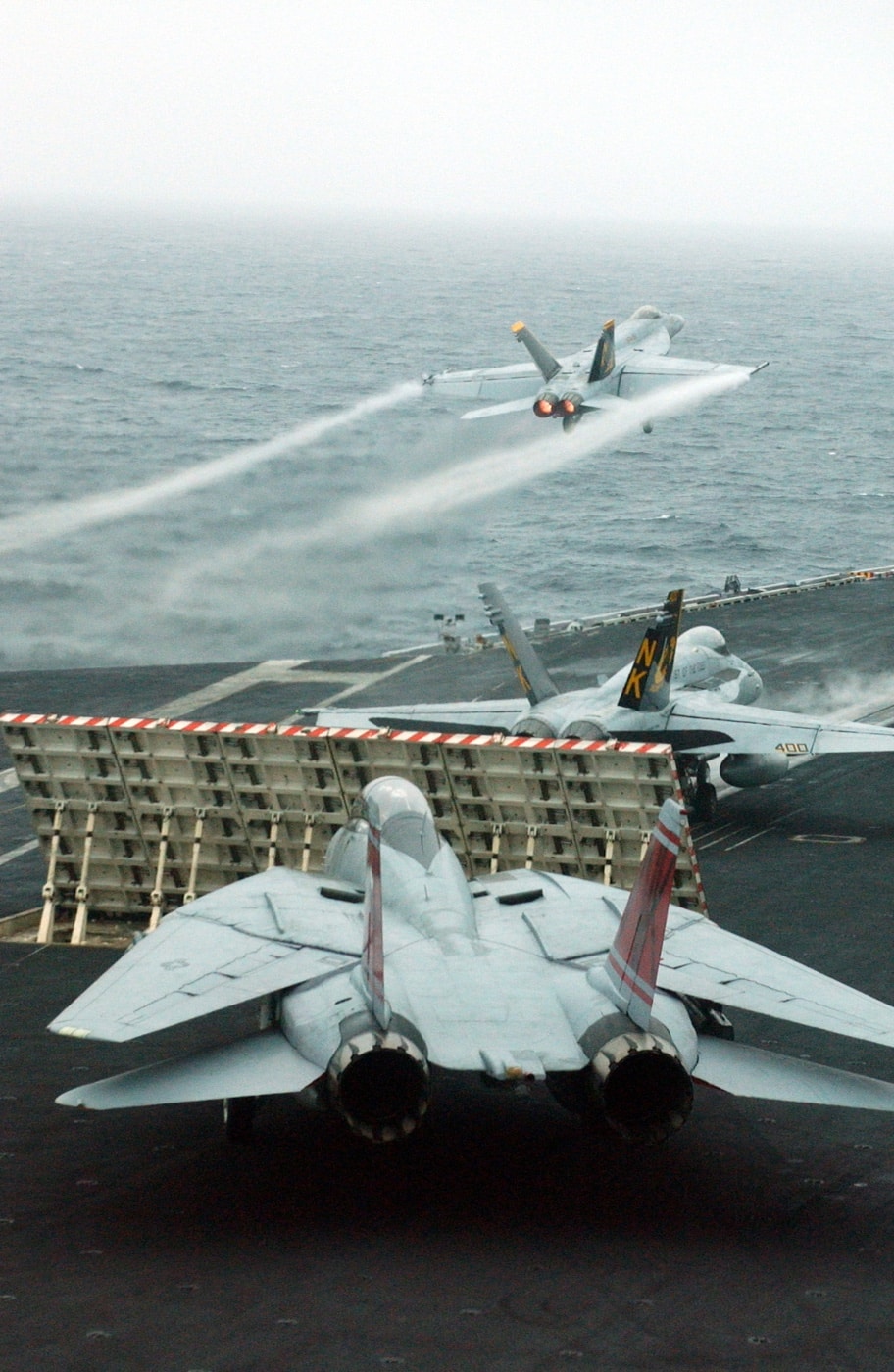 F/A-18 Super Hornet launches from USS John C Stennis F-14 Tomcat