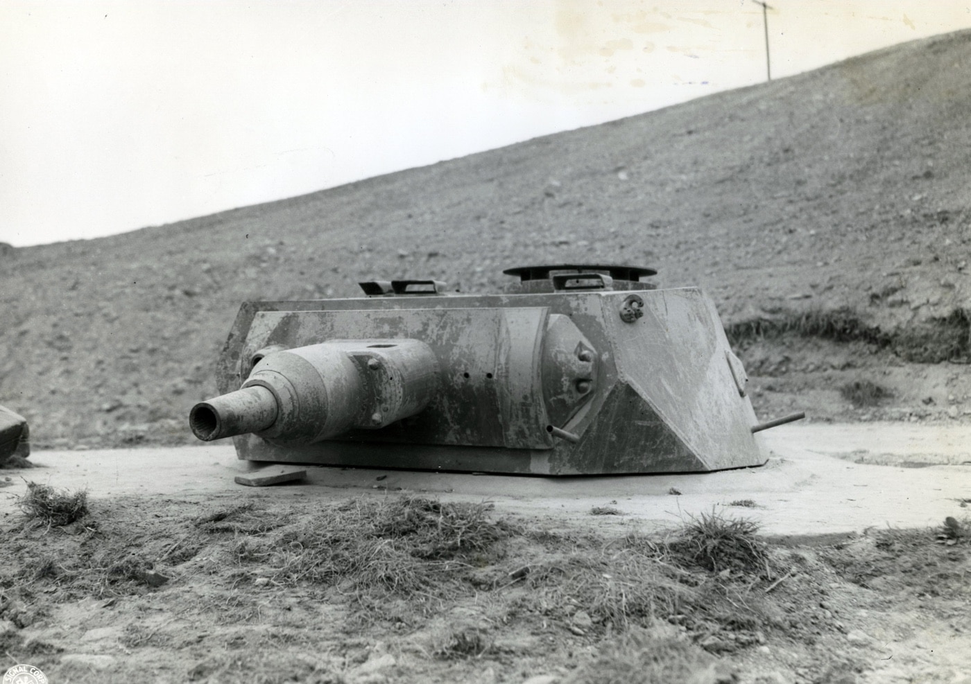 In this photo we see a German VK 30.01 (H) tank turret used as bunker on Omaha beach.