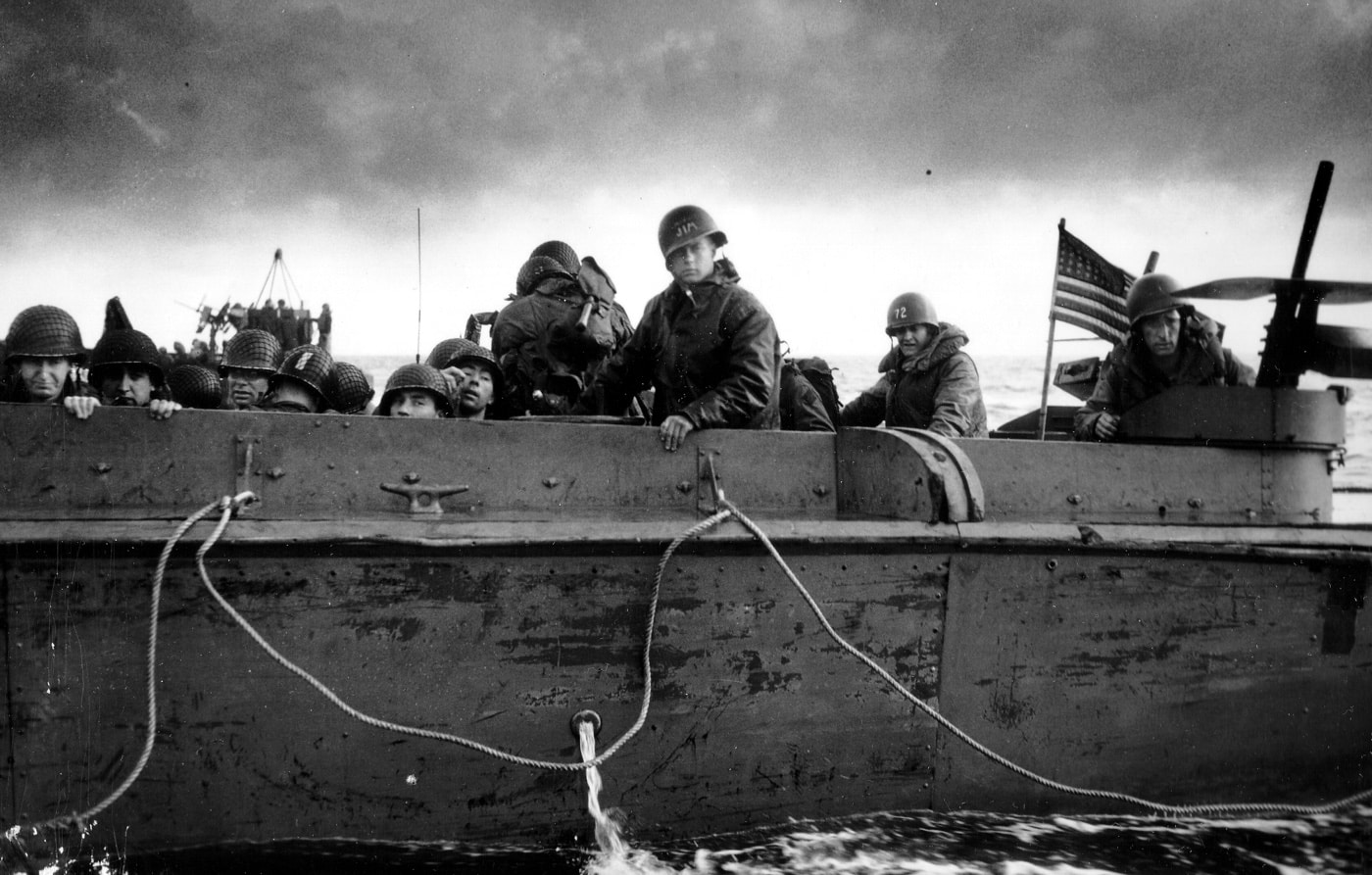 We see a Higgins Boat carrying American troops to Omaha Beach during Operation Neptune that broke Germany's Atlantic Wall.