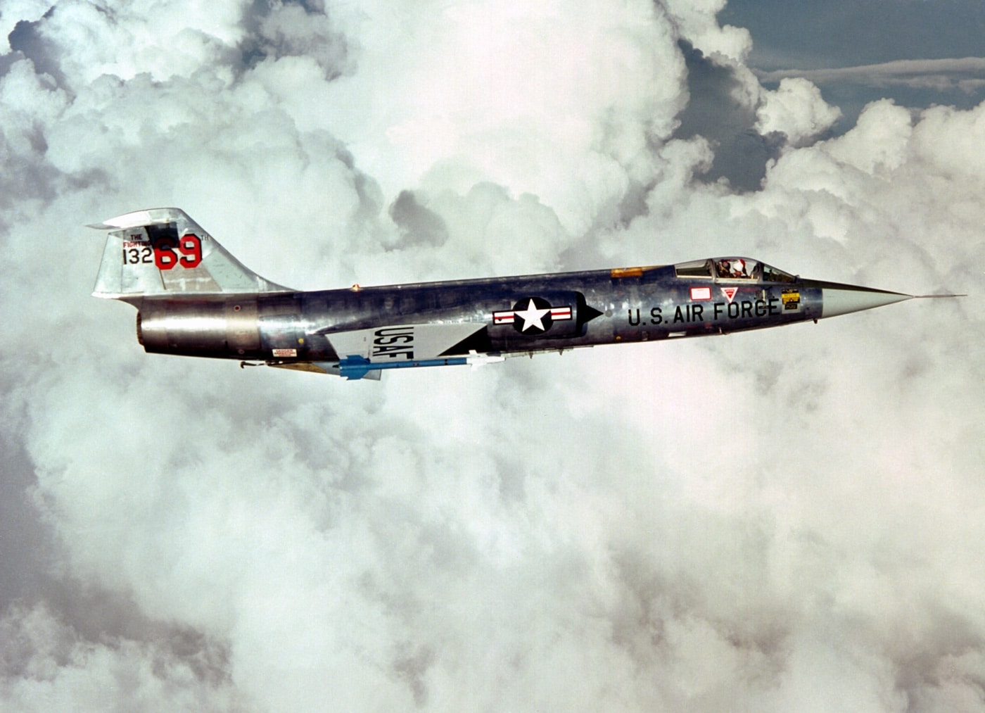 In this photograph, we see a United States Air Force F-104 equipped with a Vulcan cannon, J65 engine (a turbojet engine) and an ejection seat. The top speed and altitude of these aircraft were classified but its low speed performance was all too well known. The F-104 began service in the U.S. but was exported to allied countries around the world. It also served in the Air National Guard.