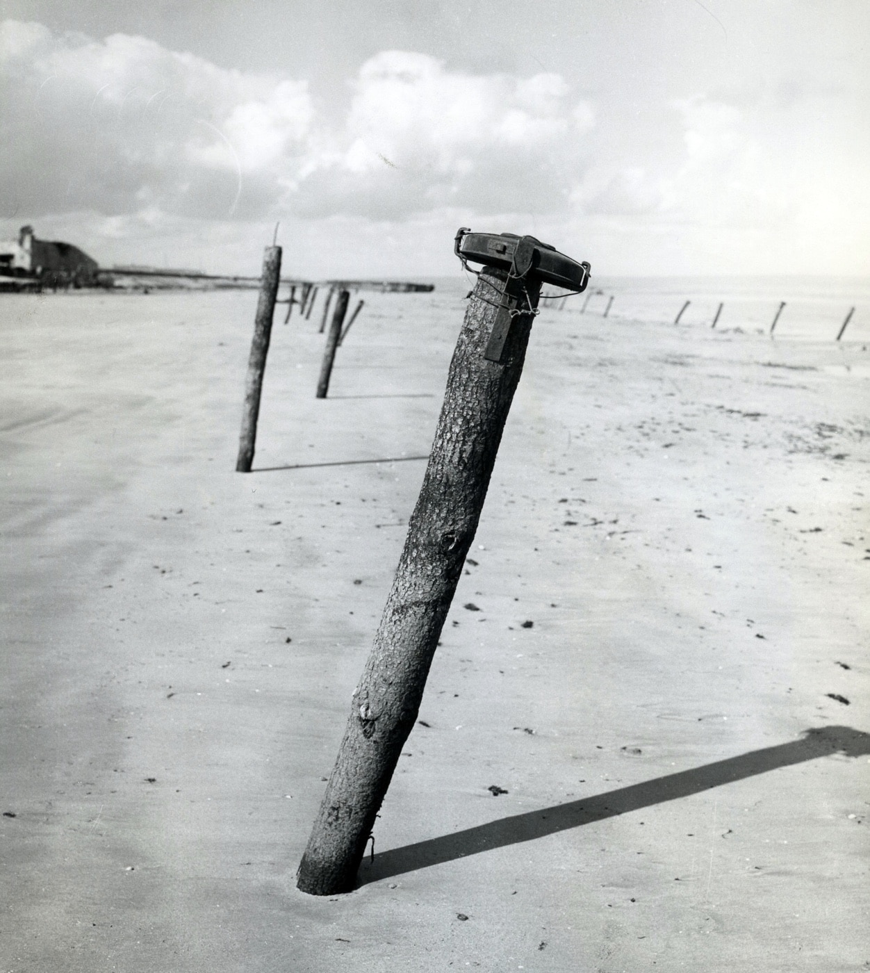 Here we see a Teller Mine attached to a wooden pole on Utah Beach. The mines were generally called Teller Mines while the German names were model specific such as Tellermine 42 or Tellermine 43.