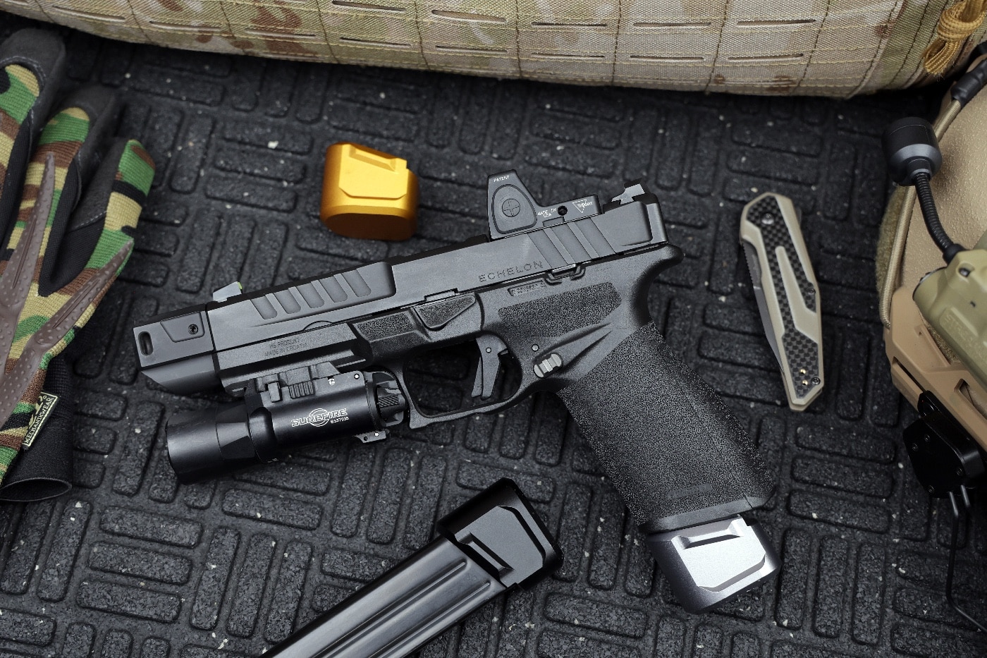 Shown here are a magazine release and extension from Tyrant CNC and a Patriot CNC compensator on a stock Echelon handgun. Tyrant CNC parts for Springfield Echelon pistol