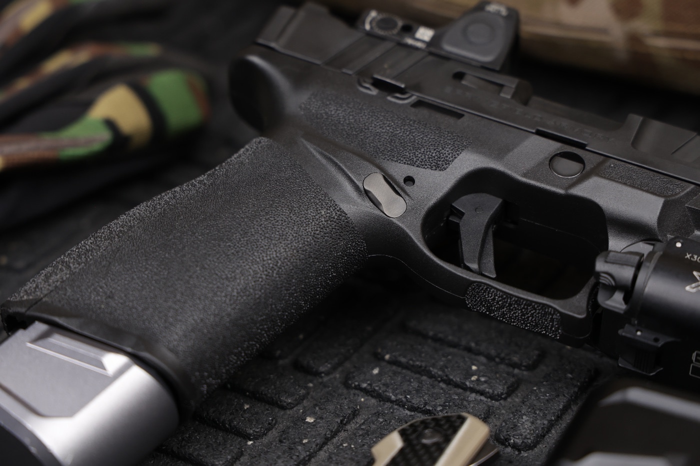 In this digital photograph, we see the Tyrant CNC magazine release for the Springfield Armory Echelon semi-automatic pistol.