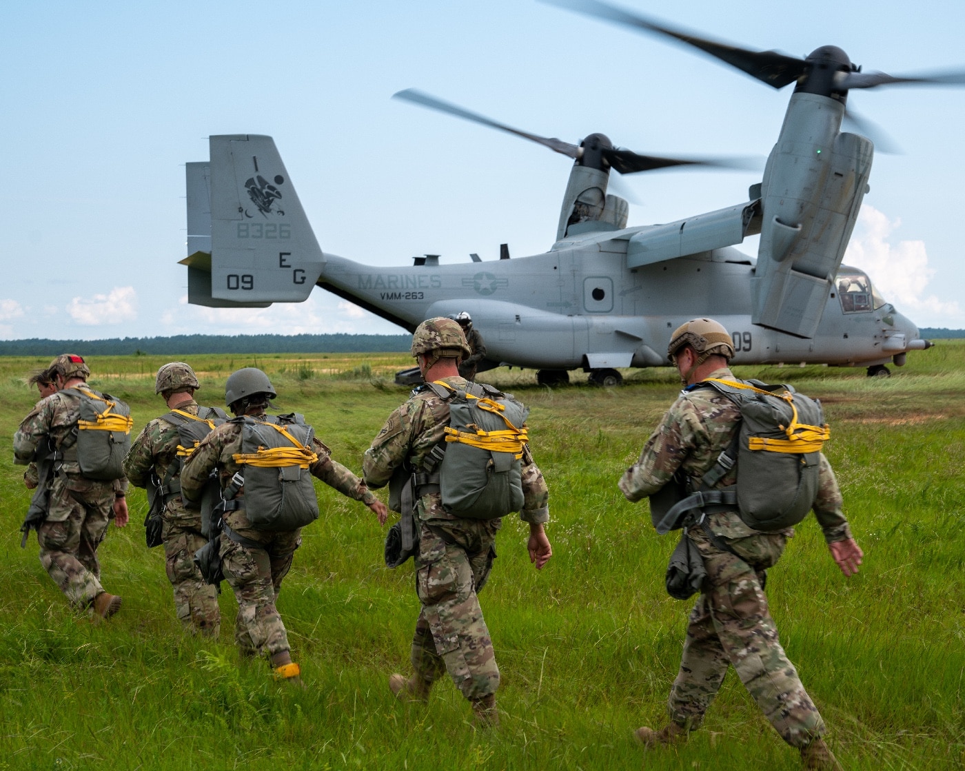 US Army paratroopers prepare to jump from Marine V-22