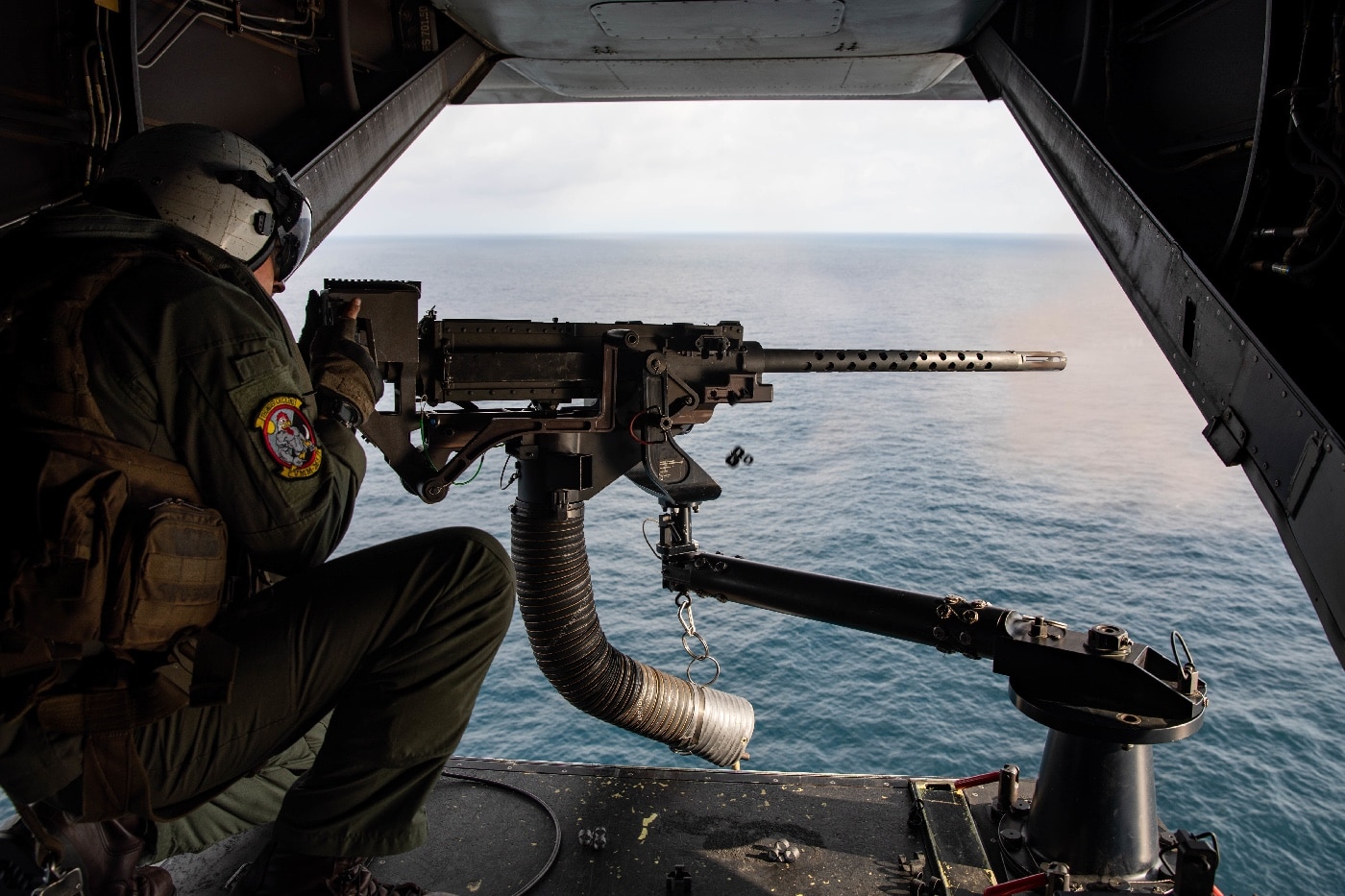 US Marine fires 50-cal machine gun from MV-22 Osprey