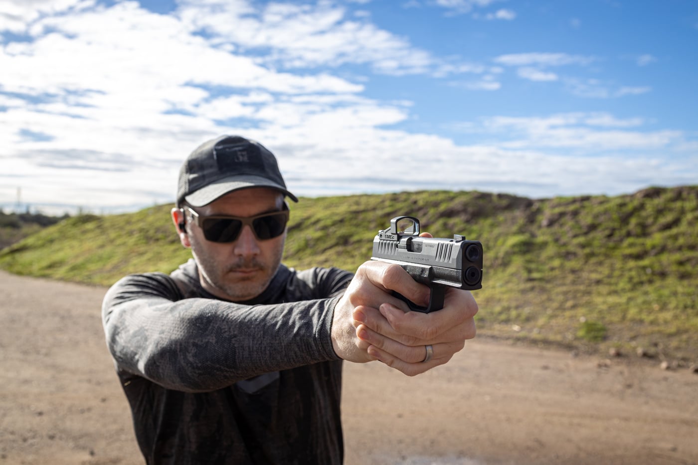 In this photo we see the author testing the Hellcat Pro Comp on the shooting range with 9mm ammo. He wanted to determine if the comp worked as advertised.