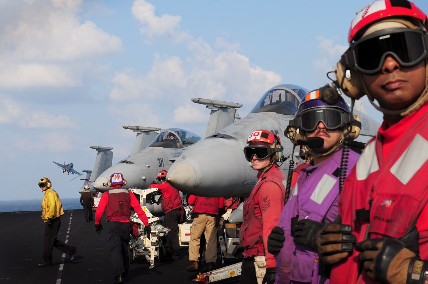 sailors stand by to launch FA-18 Enduring Freedom