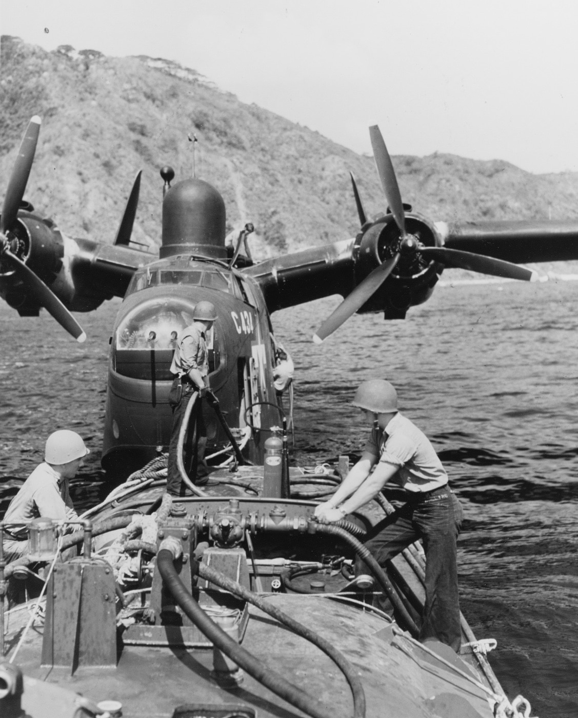 Martin PBM-5 refuels from bowser boat in Tanapag Harbor Saipan