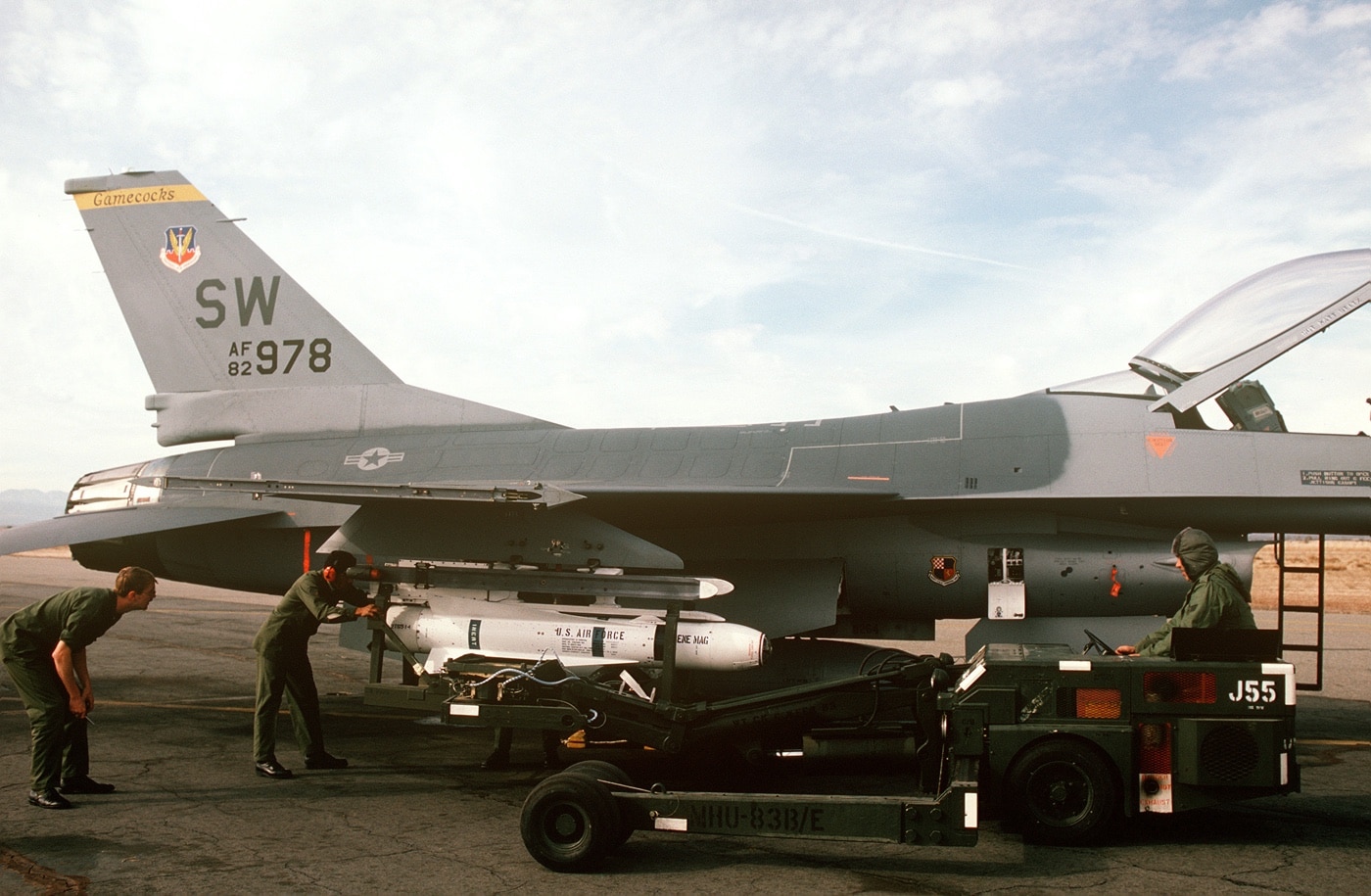 airmen load an AGM-65 Maverick missile on F-16 in 1984