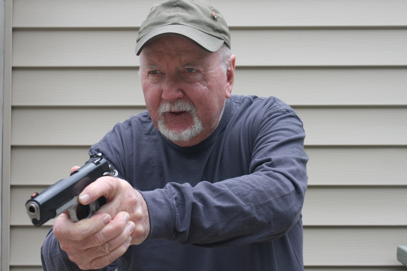 author drawing a Springfield 1911 from a holster