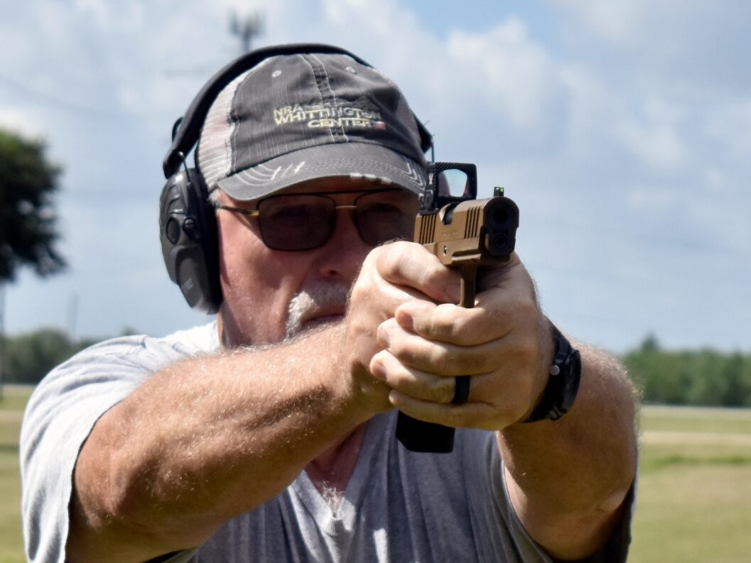 author shooting the pistol