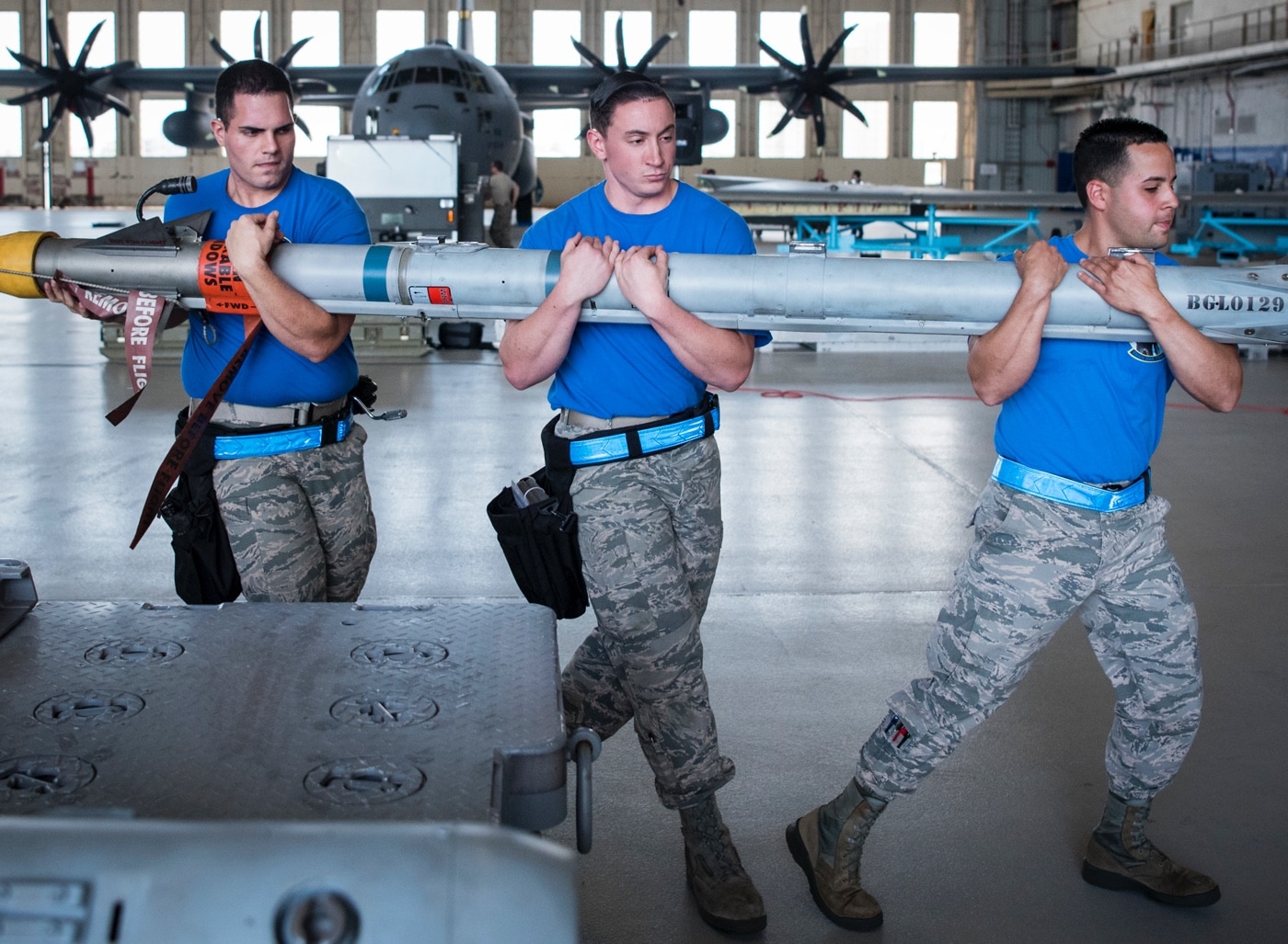 loading AIM-9X air to air missile on F-16