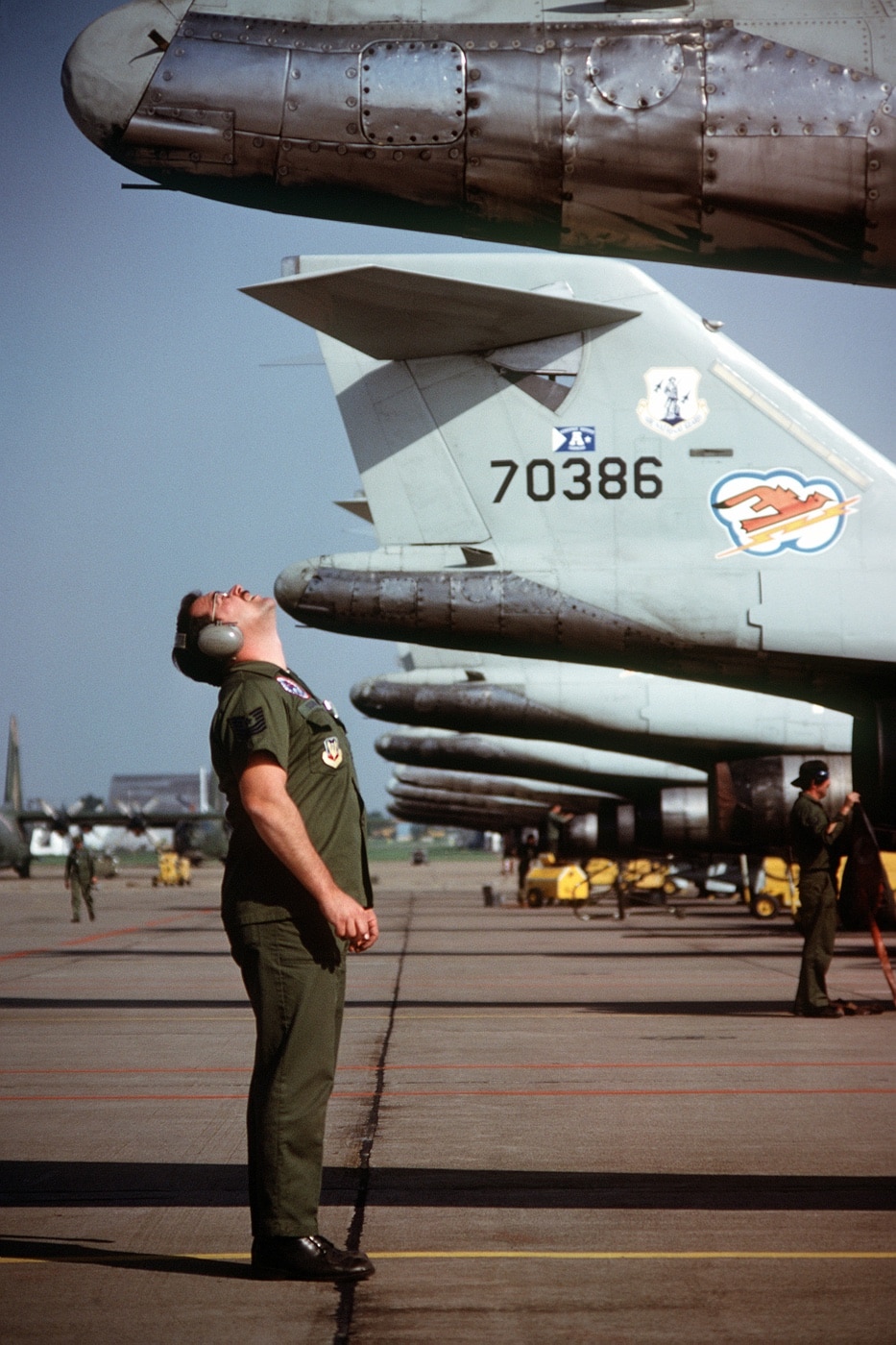 master sergeant completes pre-flight inspection of F-101B tail section