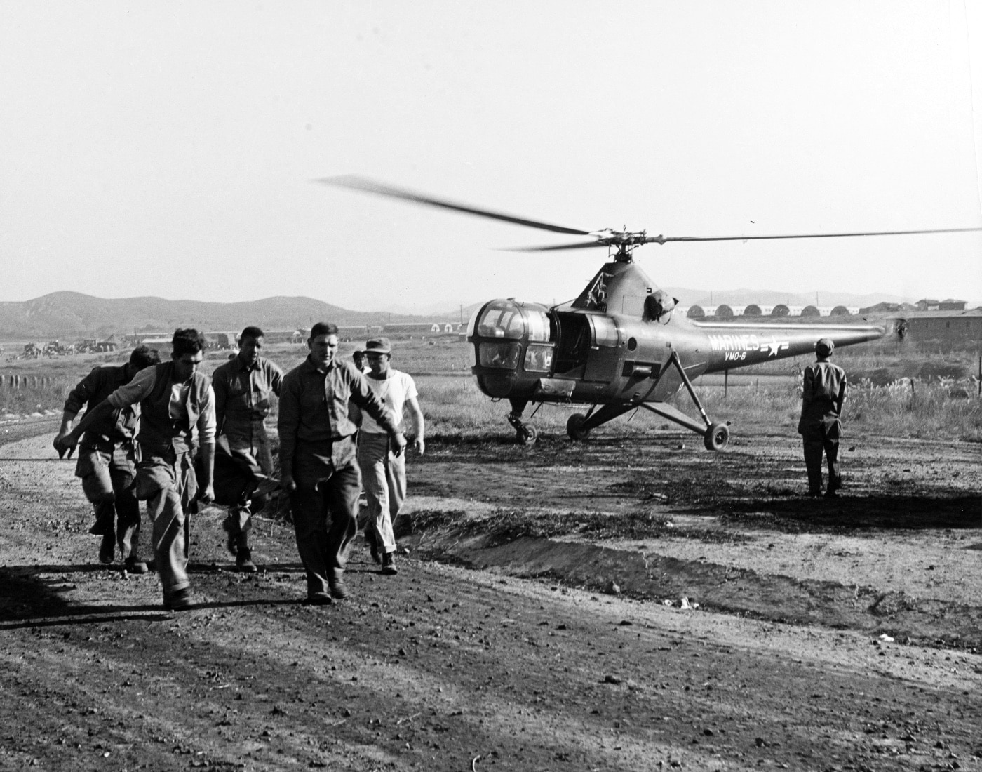 wounded Marine arrives at a mobile army surgical hospital during the Korean War