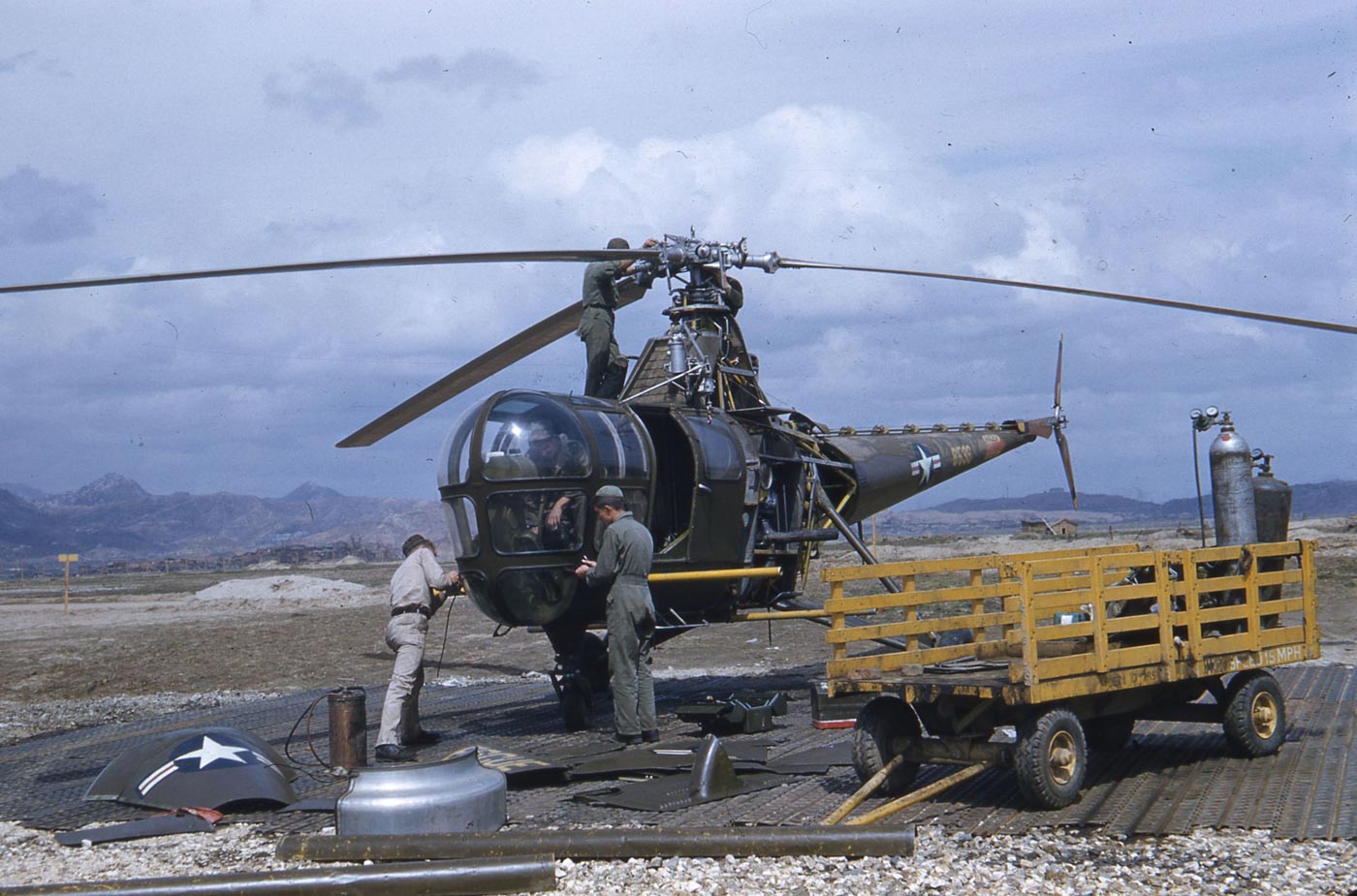 Sikorski H-5G mechanics working on helicopter