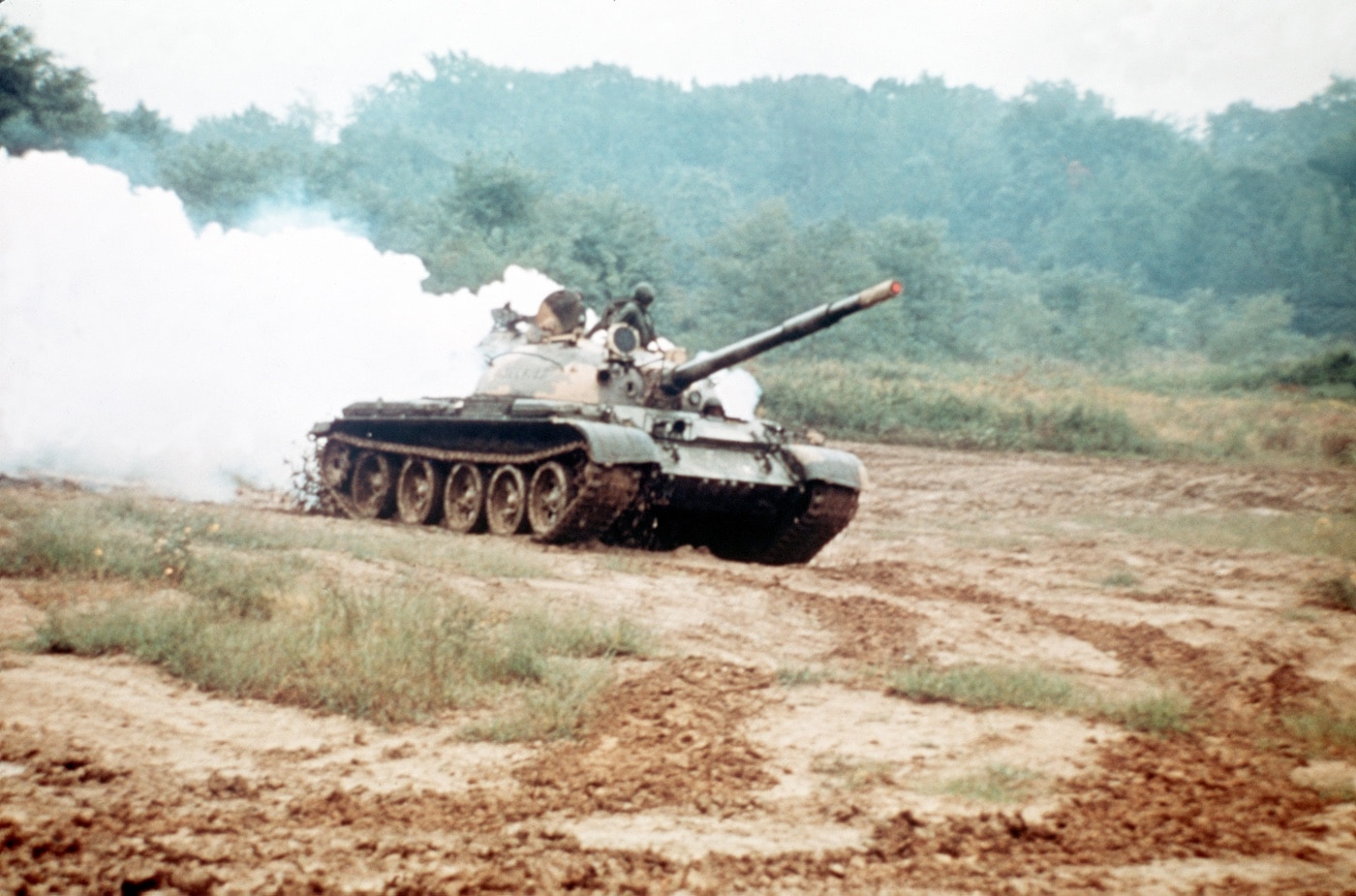 Soviet T-62 tank deploying a smoke screen during training