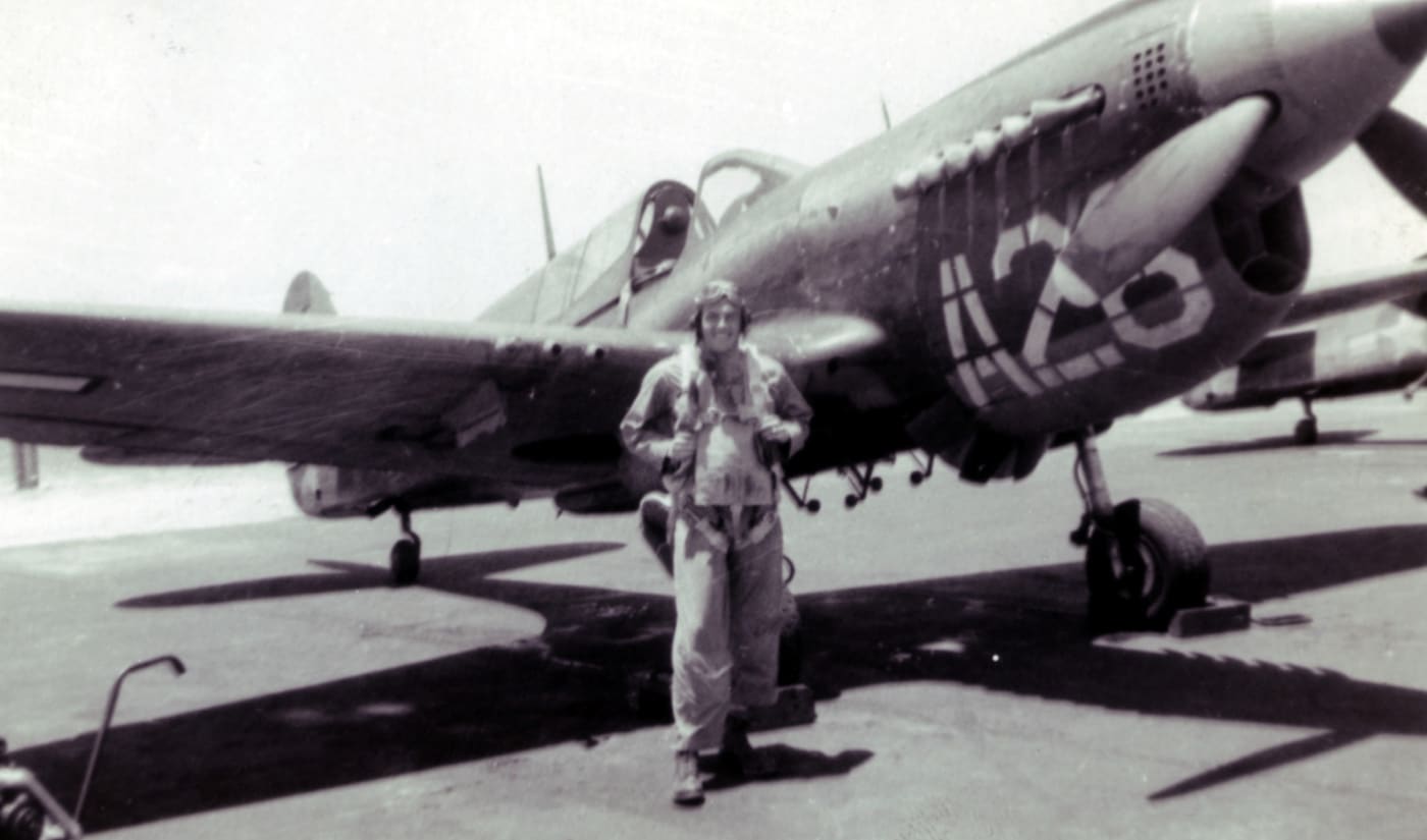 Elmer Pankratz next to his Curtiss P-40 Warhawk