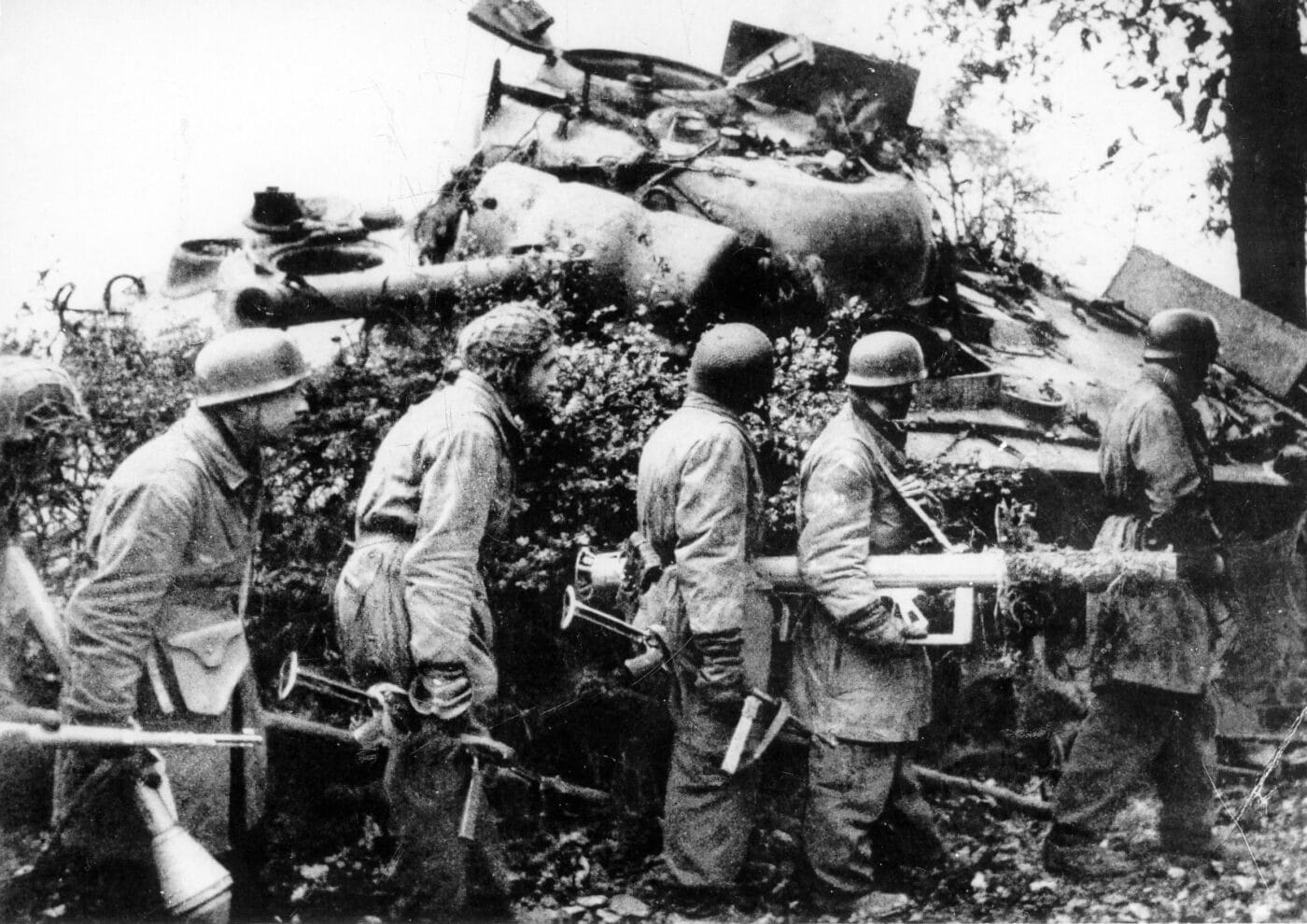 German paratroopers carry Panzerschreck and Panzerfaust