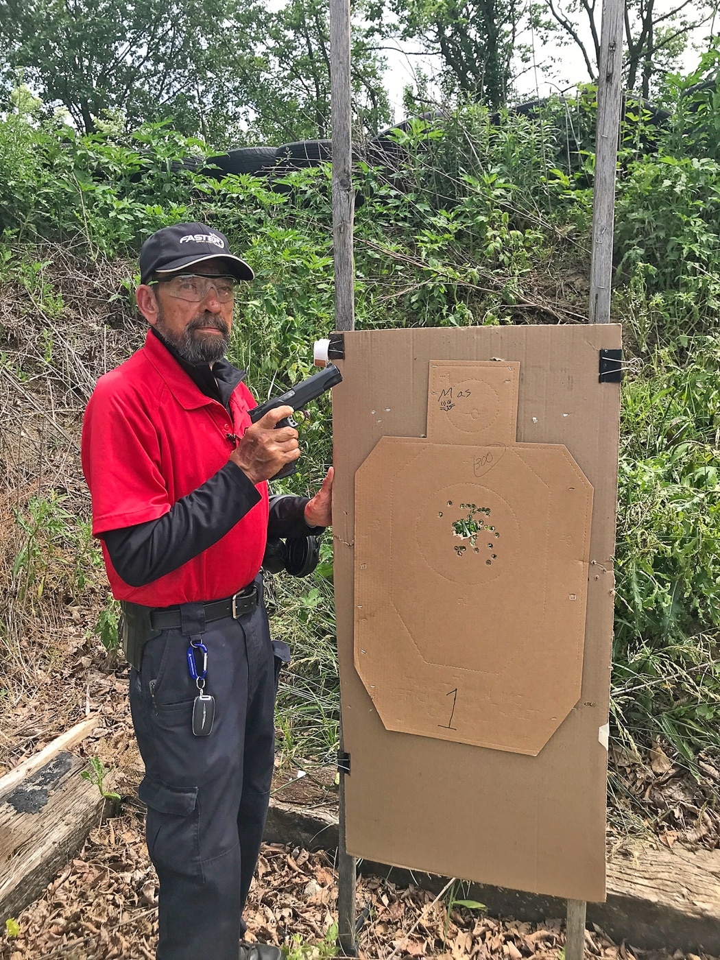 Massad Ayoob with Springfield Armory 1911 Range Officer 45 ACP pistol and shooting target