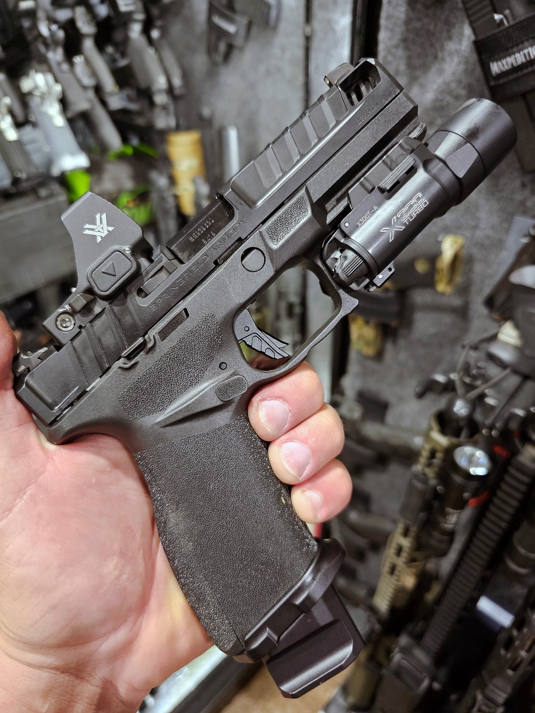 Shown here is the author's Springfield Armory Echelon equipped with a Tyrant CNC trigger SureFire X300 Turbo weapon mounted flashlight and Vortex Defender XL red dot sight.