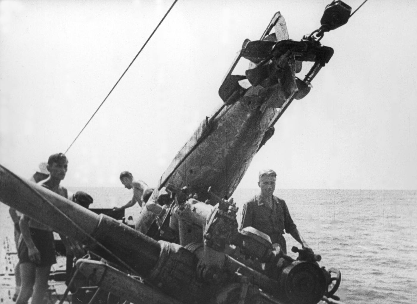 German sailors load a torpedo while at sea in April 1943