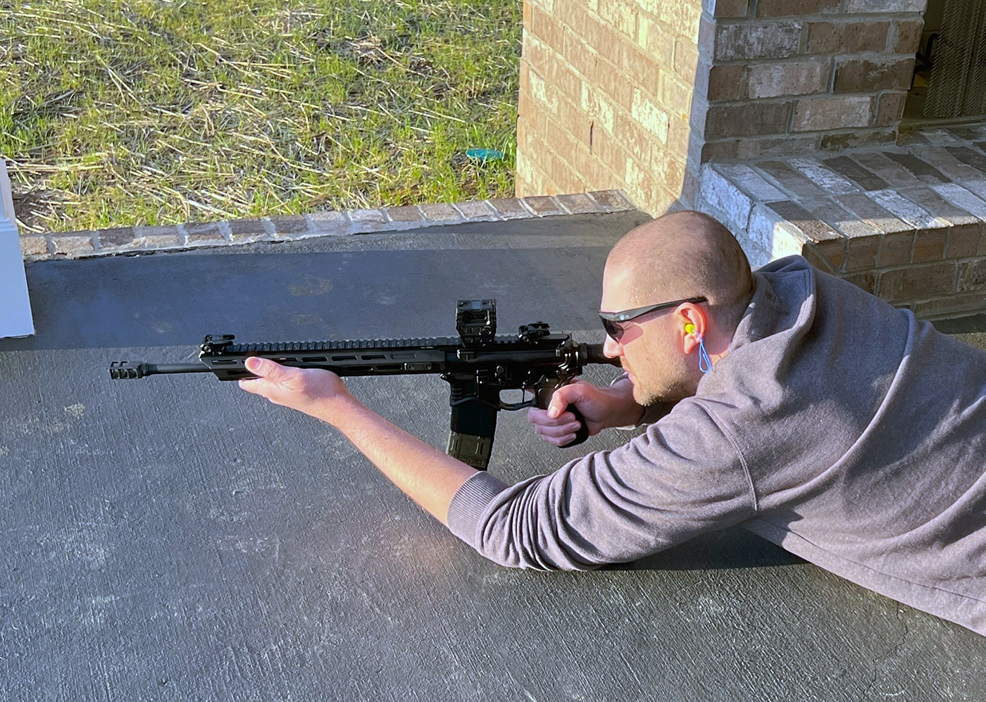 author shooting Springfield Armory SAINT rifle prone position shooting range