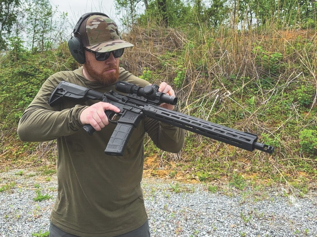 author testing the Leupold Mark 4HD rifle scope on the shooting range