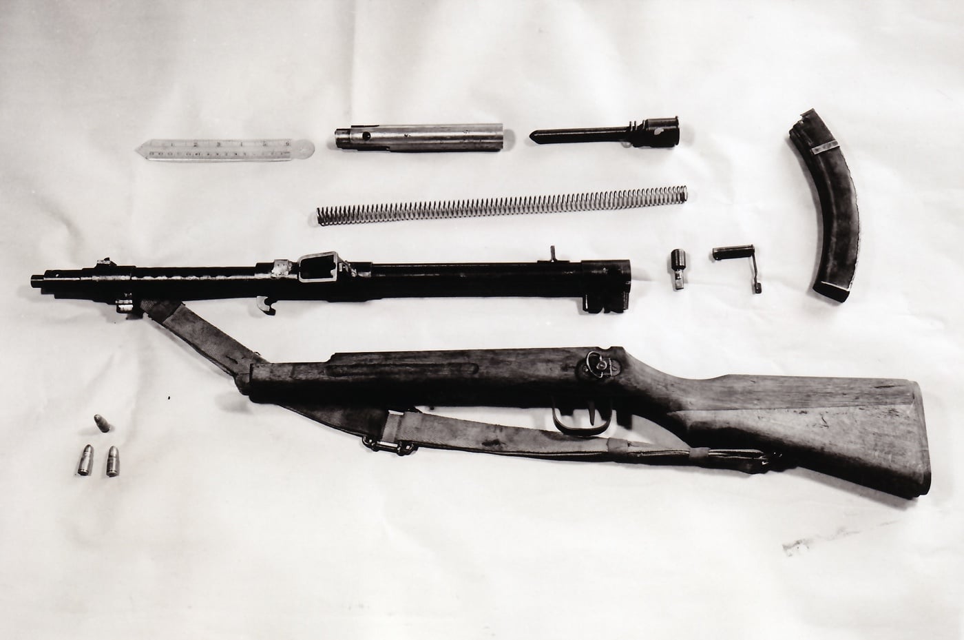 disassembled Type 100-44 submachine gun with magazine and ammunition