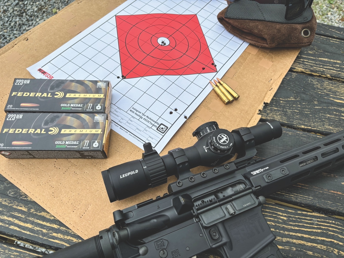 shooting target showing the accuracy and precision test results with the Springfield Armory SAINT AR-15-style rifle and the Leupold Mark 4HD scope