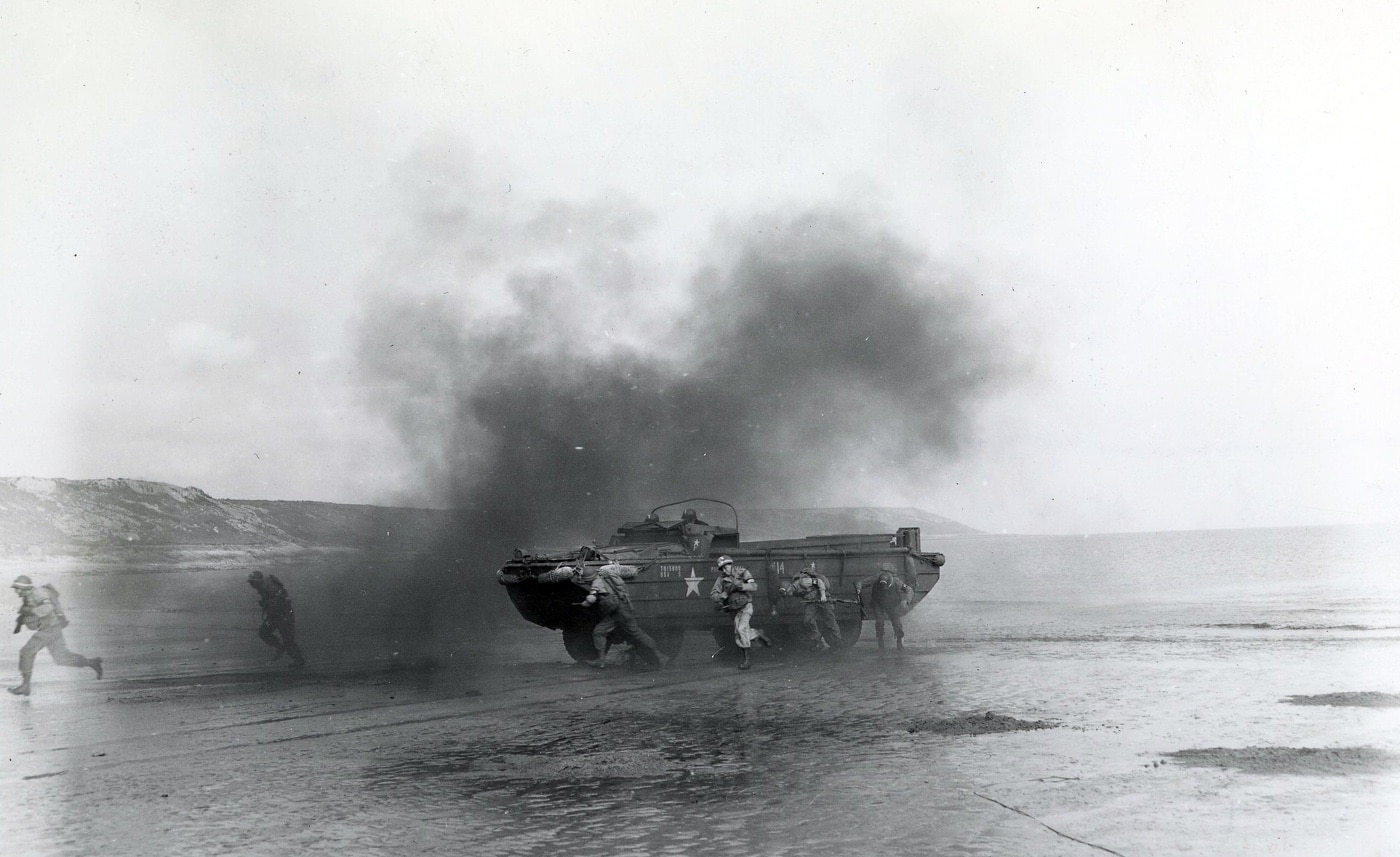 DUKW simulated fire Slapton Sands May 1944 — These soldiers train for amphibious warfare during Exercise Tiger. The training was for the Normandy landings and were protected by only one destroyer when German E-boats hit the convoy of ships.