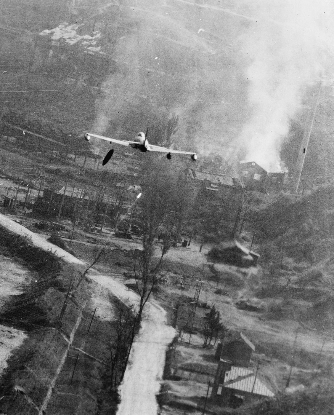 An F-80 Shooting Star attacks Chinese positions with napalm near Pyongyang, North Korea in May 1952.