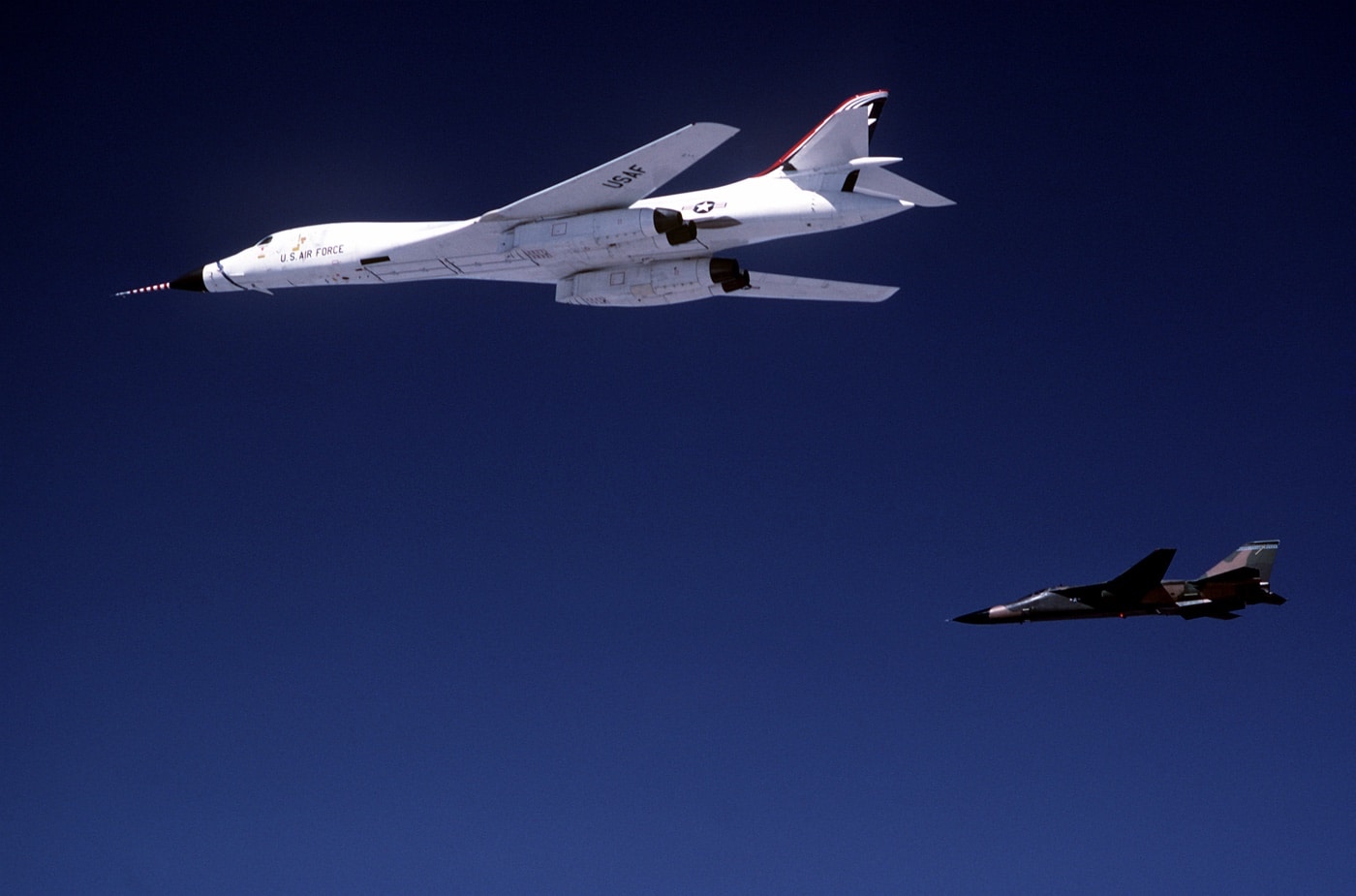 Rockwell B-1B Lancer bomber in formation with General Dynamics F-111 Aardvark