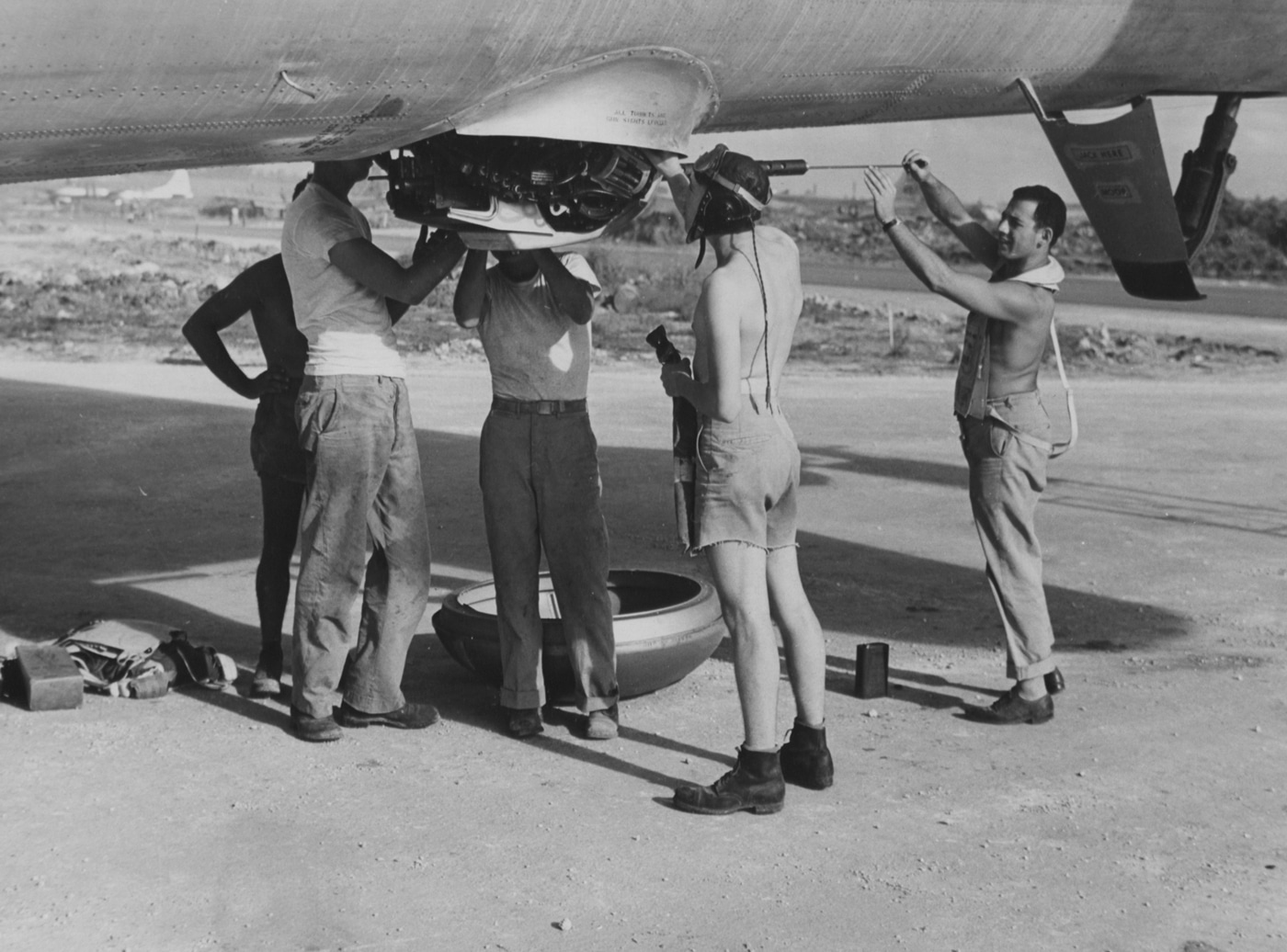 cleaning the M2 Browning machine guns on a B-29 Superfortress