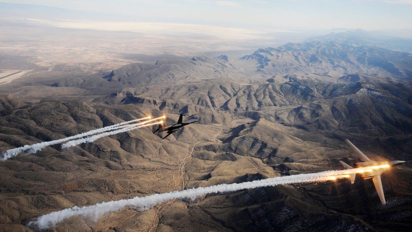 pair of B-1B bombers drop flares to evade missiles