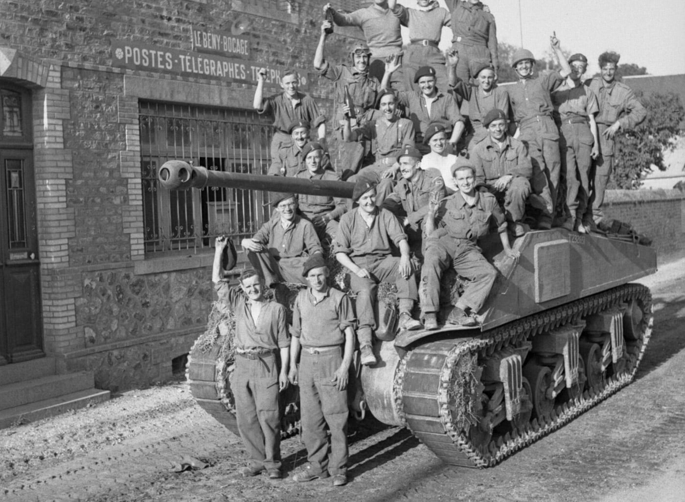 British troops take photo on Sherman Firefly after capture of Le Beny Bocage August 1944