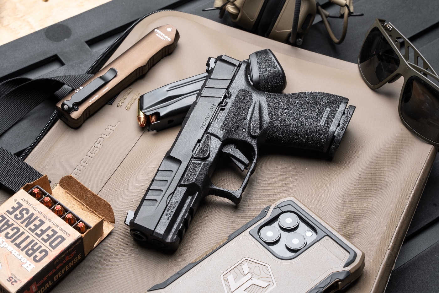 The Springfield Armory Echelon 4.0C is displayed on a shooting bench at the range, accompanied by a box of Hornady Critical Defense 9mm ammunition. The compact pistol’s robust design is matched with the high-performance ammo, ideal for testing reliability and accuracy. This image highlights the Echelon 4.0C as a trusted choice for personal defense and range practice with premium defensive rounds.