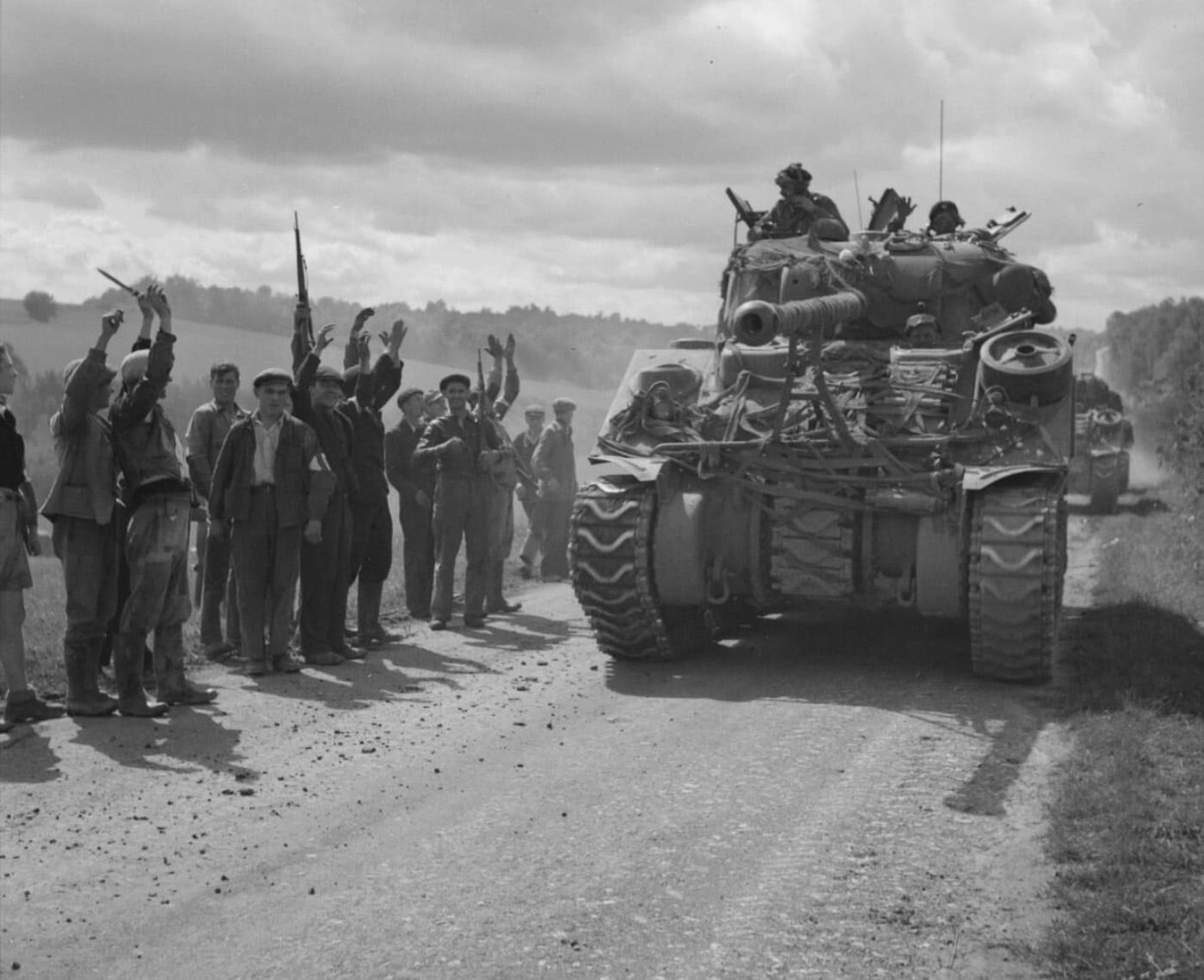 French Forces of the Interior cheer a British Sherman Firefly August 1944