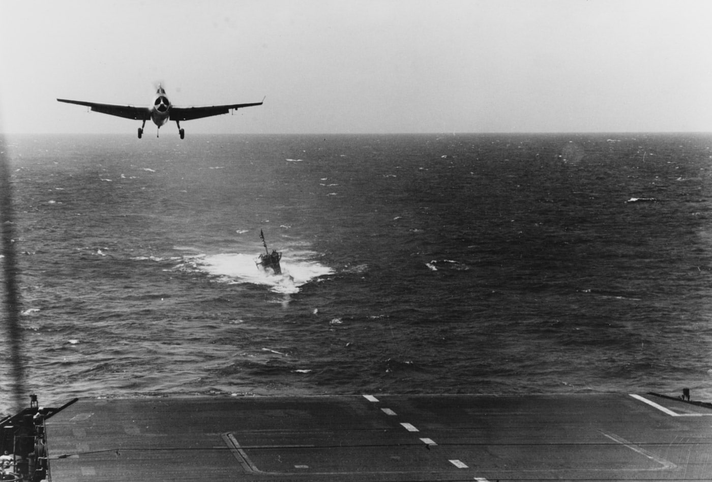 Grumman TBF Avenger lands on USS Guadalcanal as the U-505 is being towed