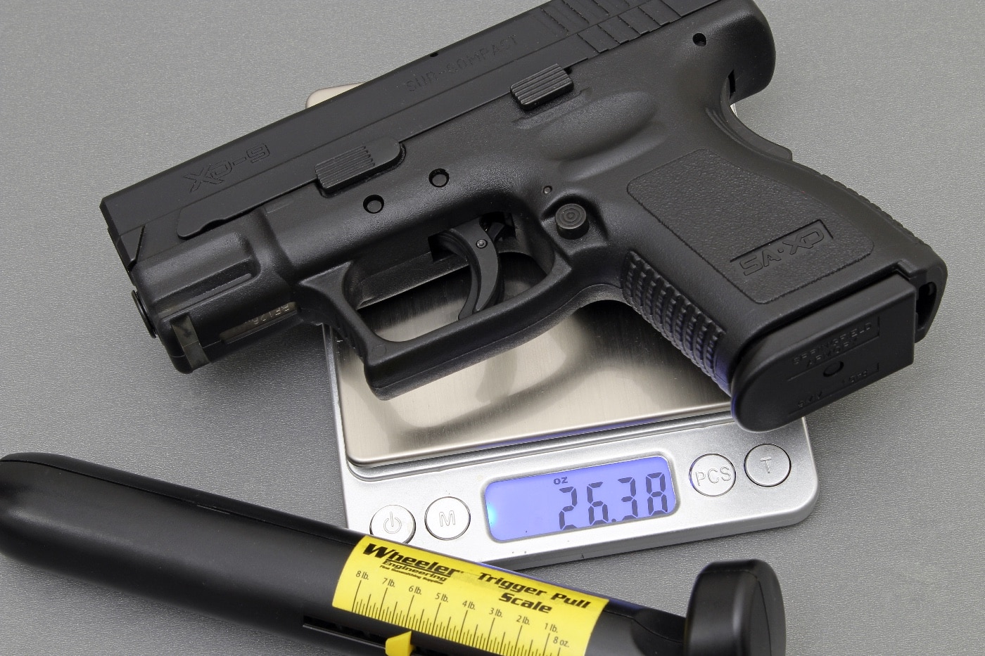 A Springfield Armory XD subcompact pistol used in dry fire training to refine trigger control. The exercise emphasizes managing trigger resistance, which often exceeds the weight of the gun itself. This method helps shooters maintain stability while overcoming trigger pull. Dry fire practice is a valuable tool for improving shooting accuracy and fundamentals.