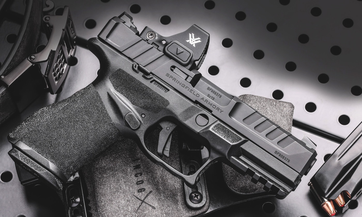 A right-side view of the Springfield Armory Echelon 4.0C compact 9mm pistol, featuring a black polymer frame, optics-ready Melonite finished slide, tactical rack U-Dot sights, and a 4-inch hammer-forged barrel designed for enhanced durability and accuracy.